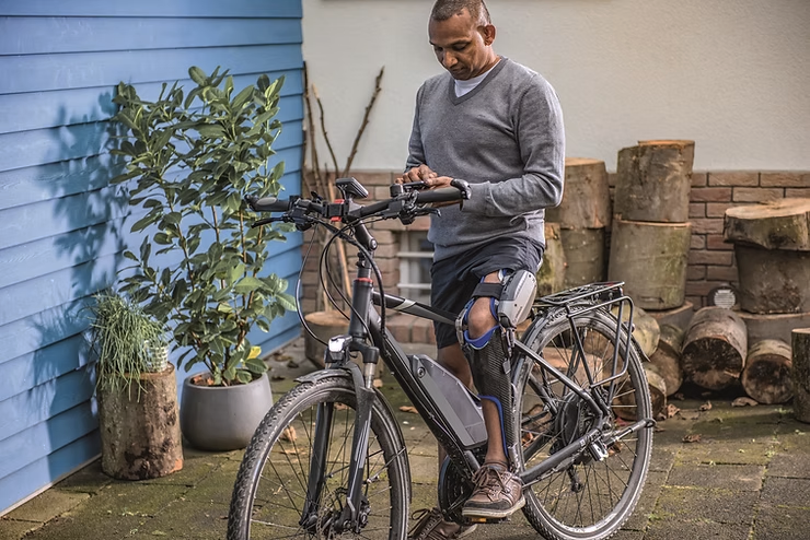 man on bike with orthotic support 740x494