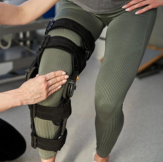 fitting patient with leg brace
